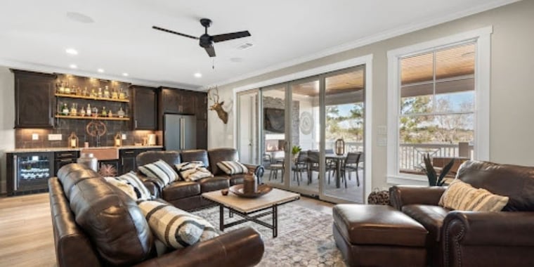 Spacious Living Room with Patio Door to Beautiful Deck