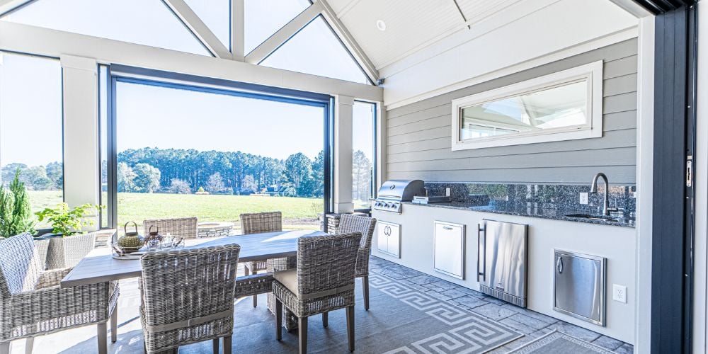 Beautiful Enclosed Outdoor Kitchen Area by PAXISgroup Custom Home Builders in GA