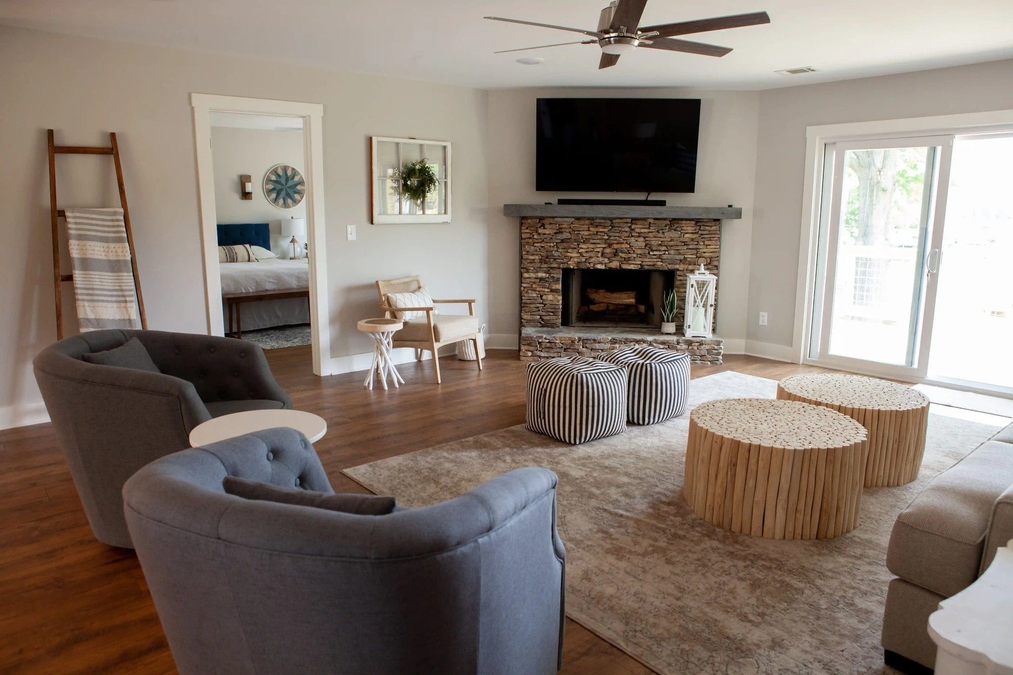 Living Room with Stone Fireplace in Remodeled Home _ PAXISgroup Custom Home Builders in GA_11zon (1)