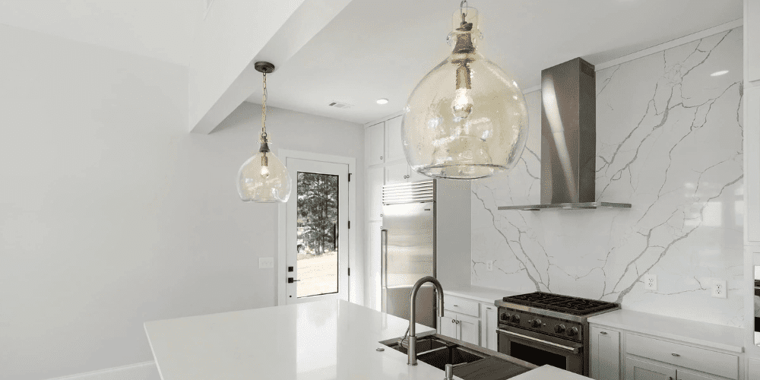 Bright Kitchen with Granite Backsplash