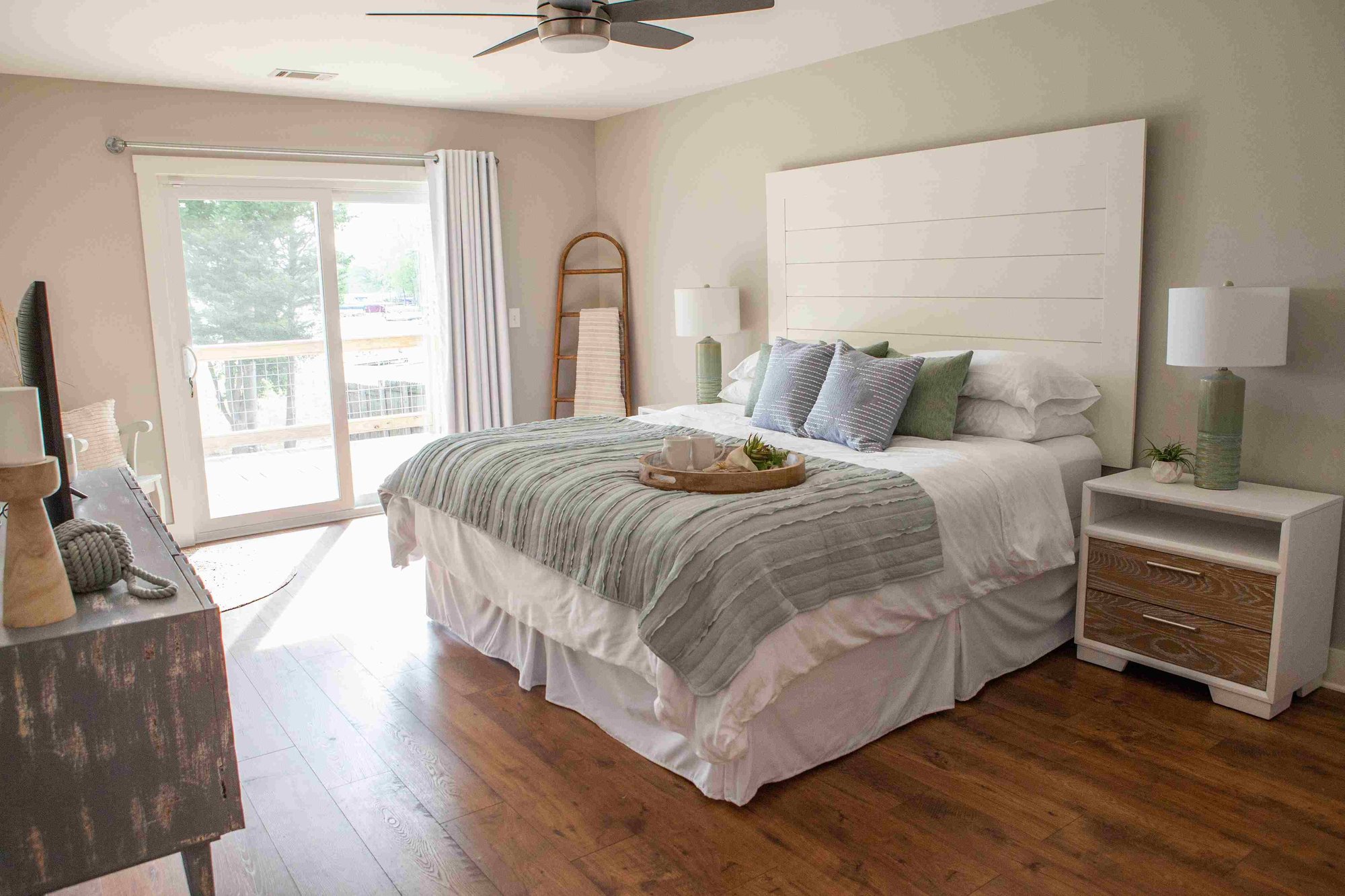 Primary Bedroom with Sliding Glass Door and Shiplap Headboard _ PAXISgroup Custom Home Builders in GA_11zon Primary Bedroom with Sliding Glass Door and Shiplap Headboard _ PAXISgroup Custom Home Builders in GA_11zon
