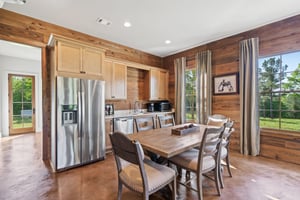 Beautiful Wood-Toned Kitchen and Dining Area | PAXISgroup