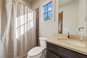 Single-Vanity Bathroom with Beautiful Rustic Features | PAXISgroup