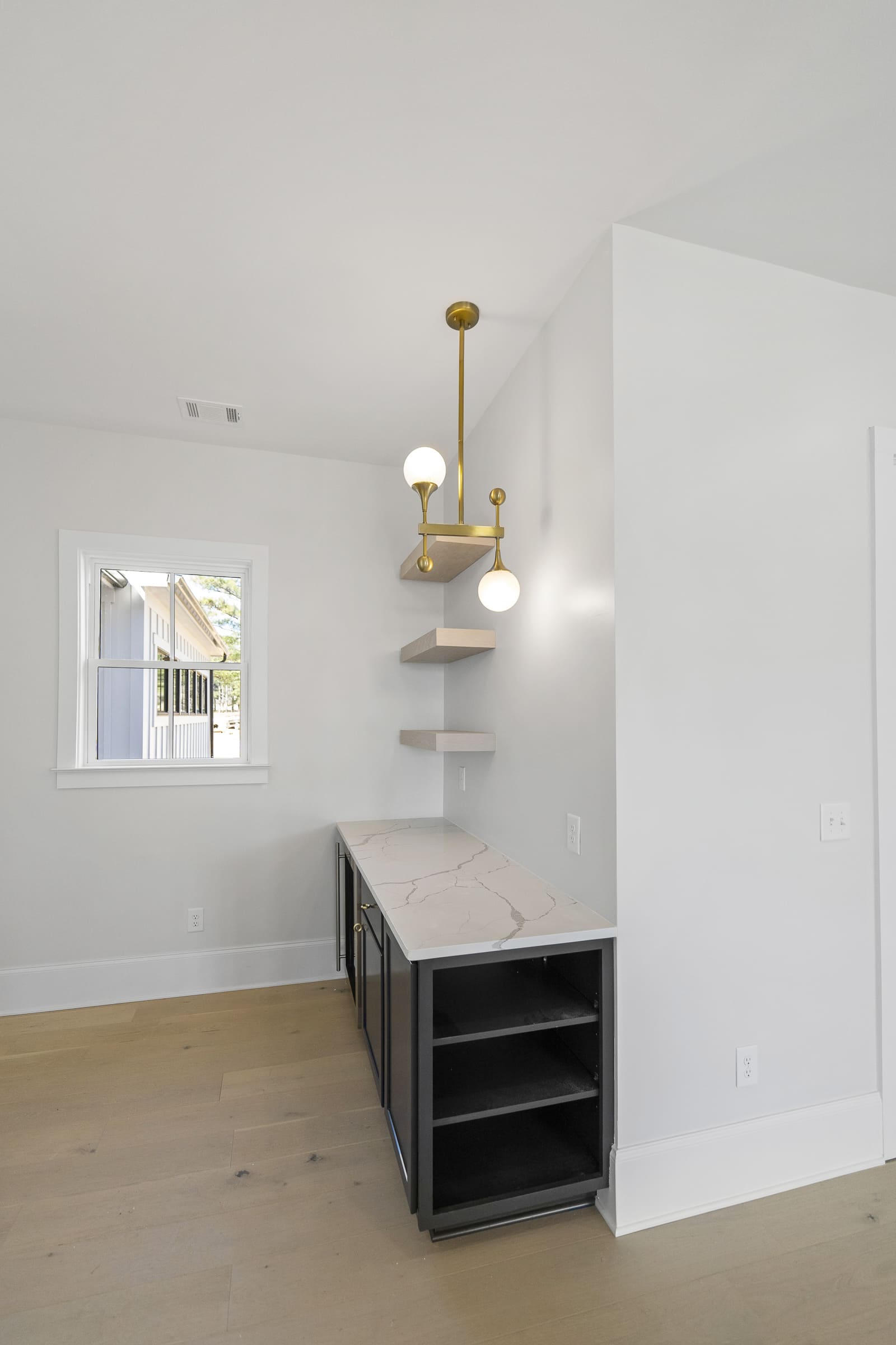 Floating Shelves Above Dark Wood Cabinet with Light Stone Granite Countertop |PAXISgroup