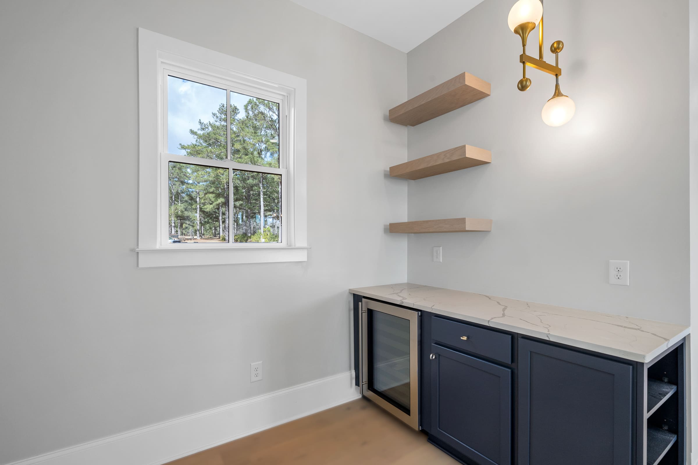 Mini Bar Area with Floating Shelves and Built in Mini Fridge |PAXISgroup