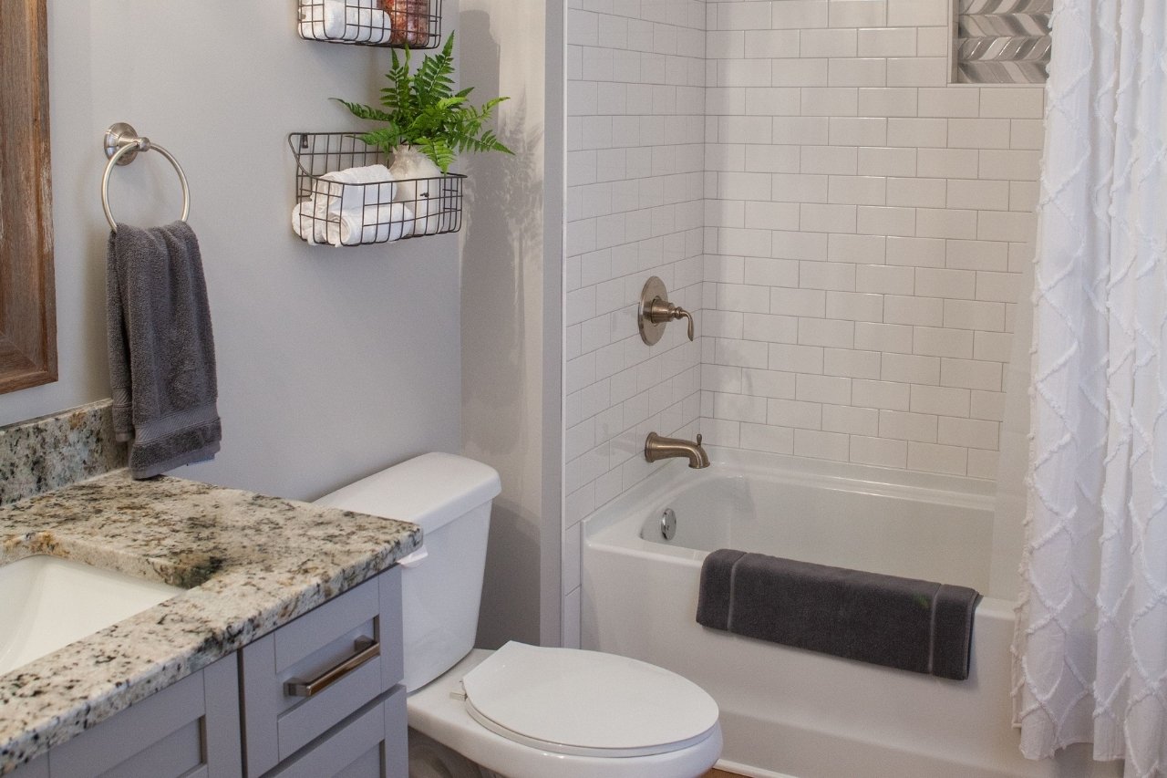 Guest Bathroom with Tile Shower and Granite Countertop Sink | PAXISgroup Custom Home Builders in GA