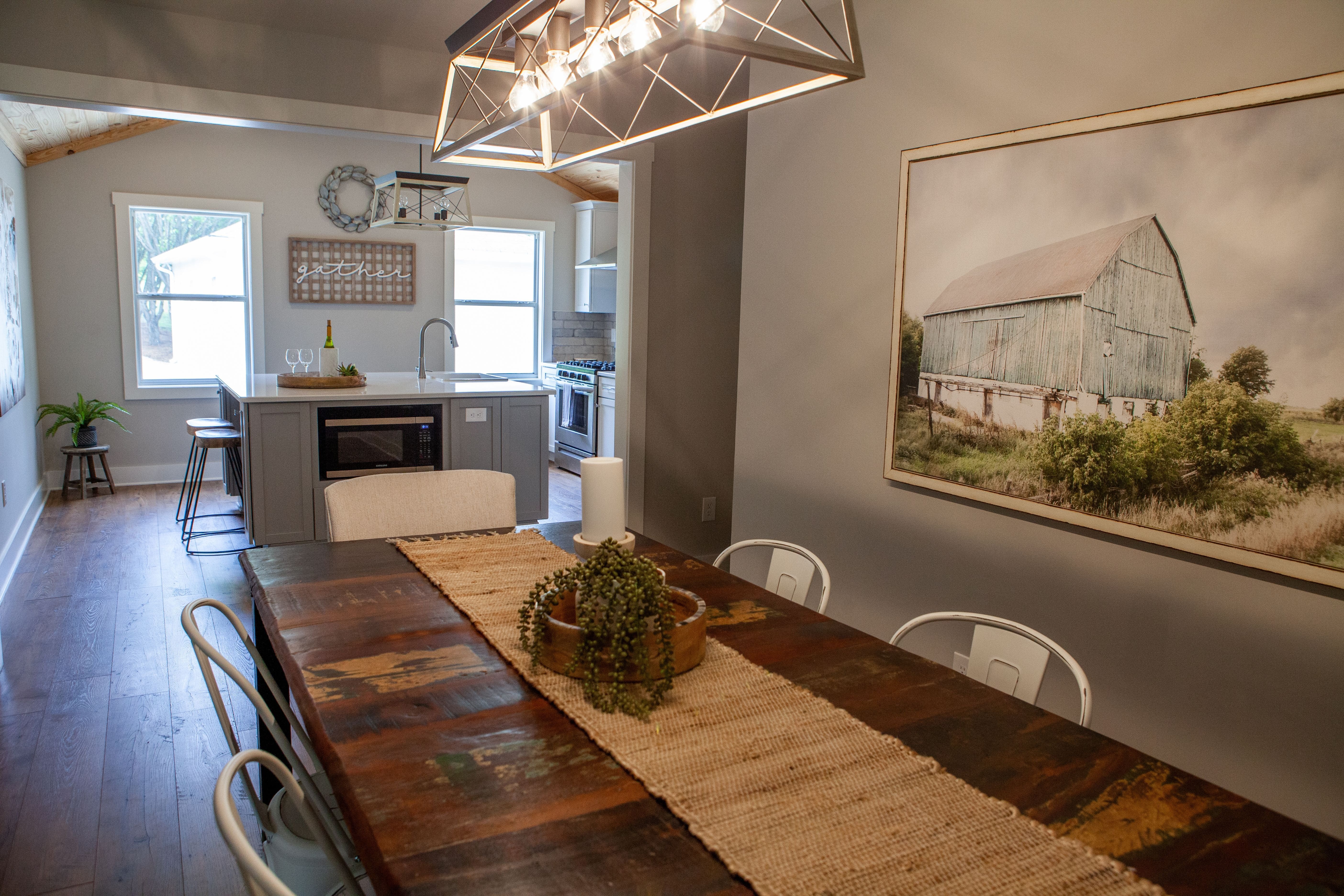 Modern Farmhouse Dining Room Table in Remodeled Home | PAXISgroup Custom Home Builders in GA Modern Farmhouse Dining Room Table in Remodeled Home | PAXISgroup Custom Home Builders in GA