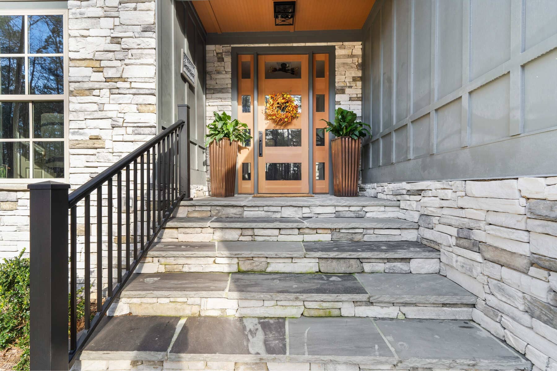 Front Door Entrance with Light Wood Accents and Stone Walkway and Stairs |PAXISgroup