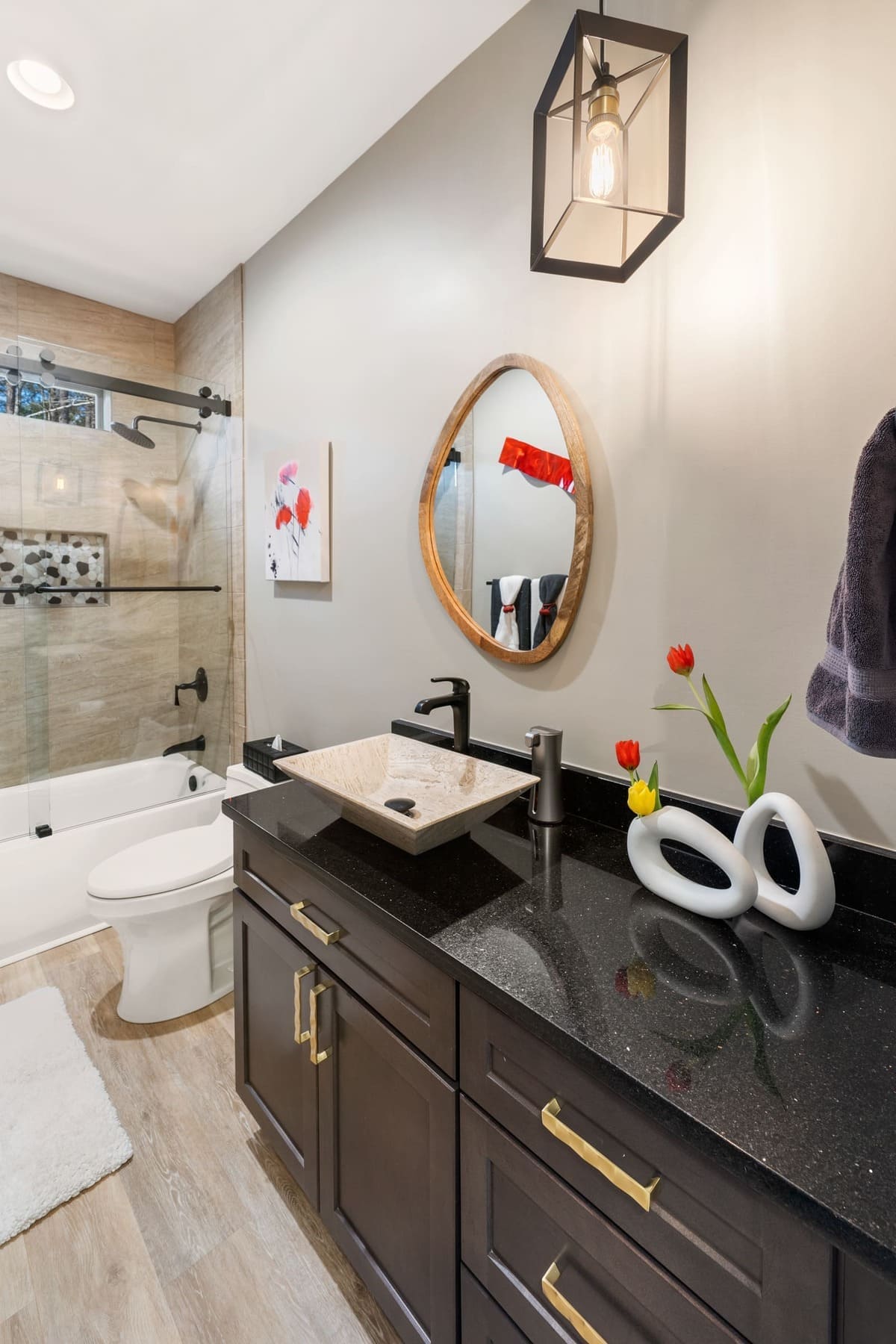 Full Bathroom with Beautiful Dark Grantite Countertop and Dark Wood Cabinetry |PAXISgroup