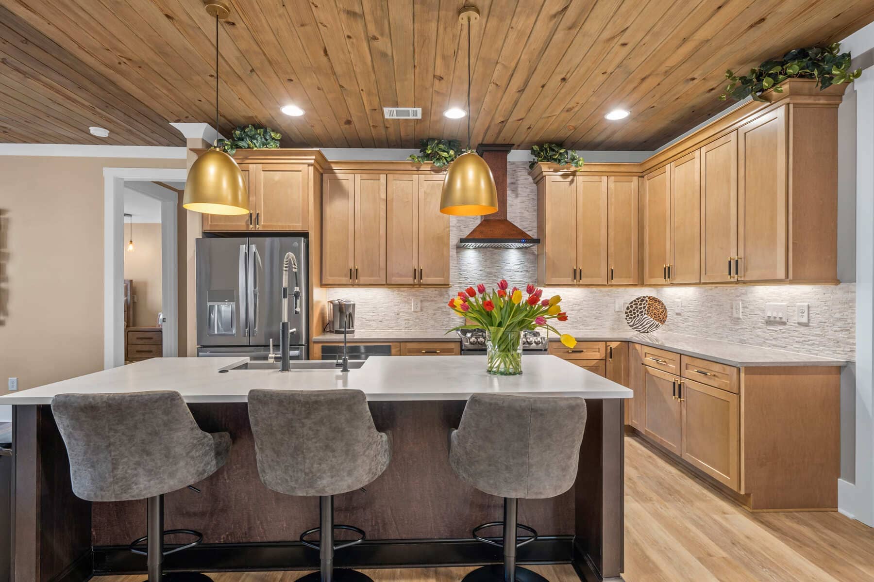 Full Kitchen View with Light Wood Cabinetry and Light Grey Features |PAXISgroup