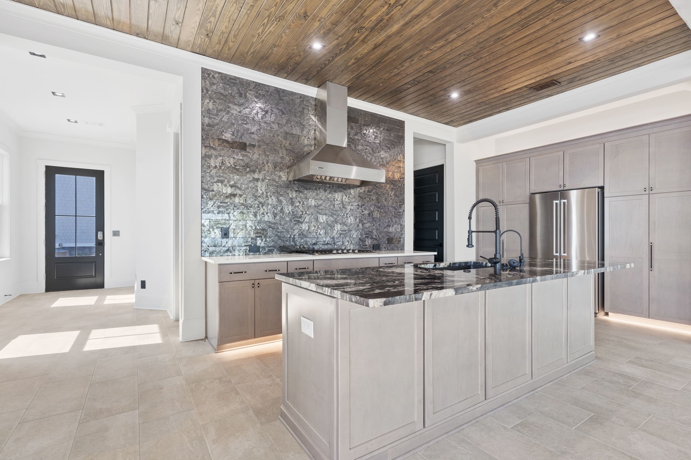 Full Kitchen View with Back Stone Kitchen Wall |PAXISgroup