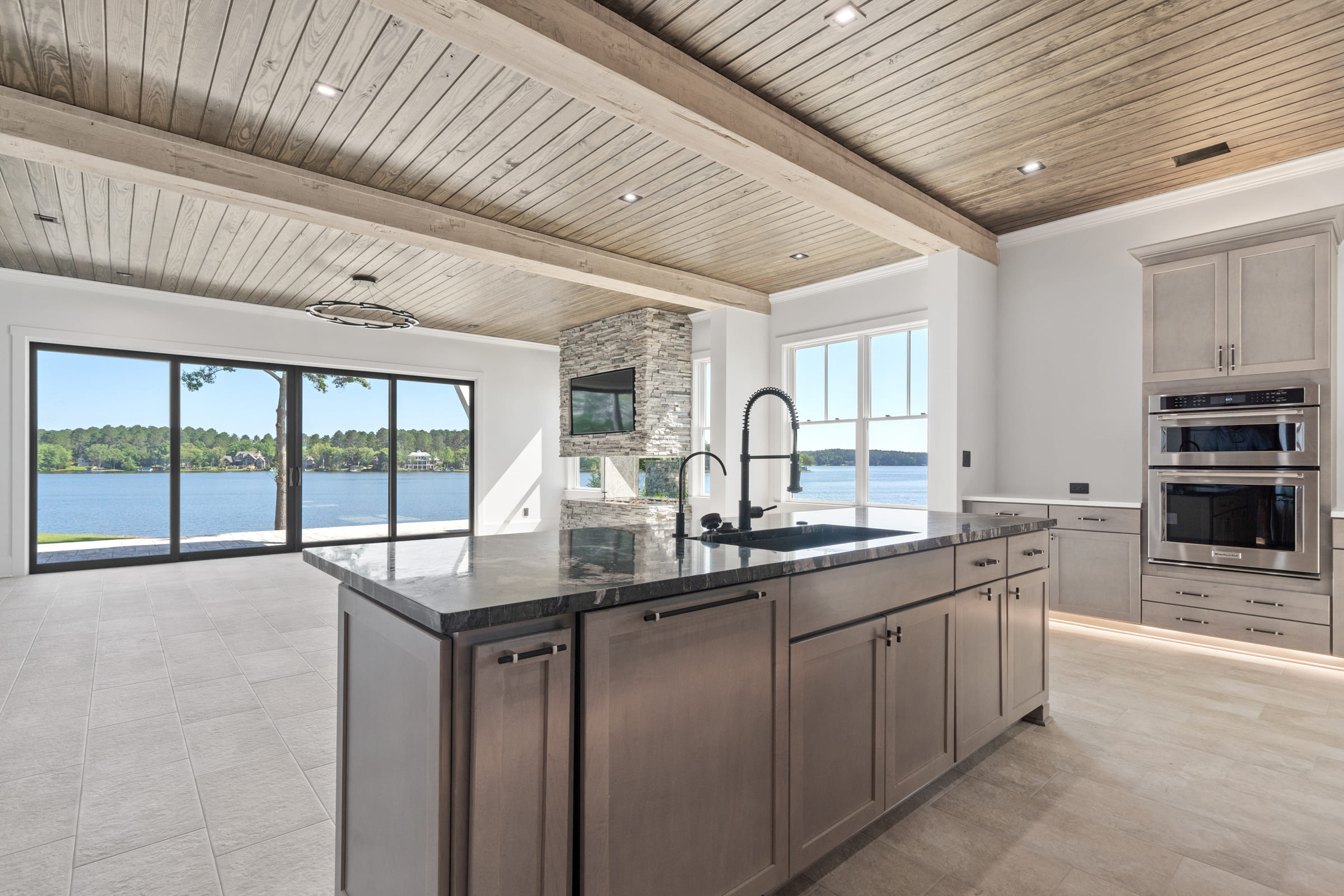View of Kitchen Island and Sink with Patio Doors |PAXISgroup View of Kitchen Island and Sink with Patio Doors |PAXISgroup