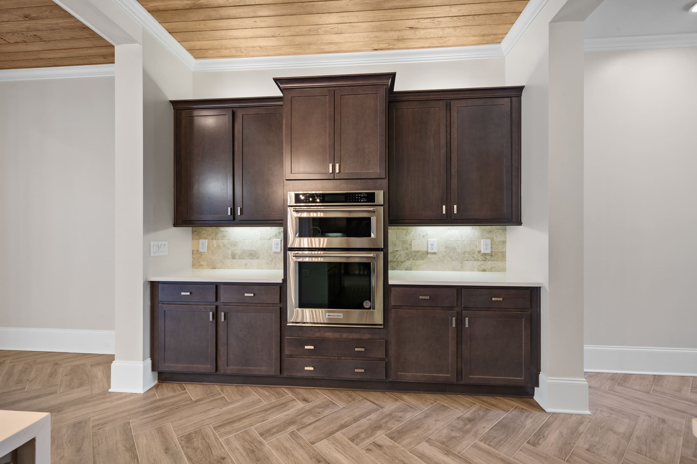 Stainless Steel Oven and Hardwood Cabinetry