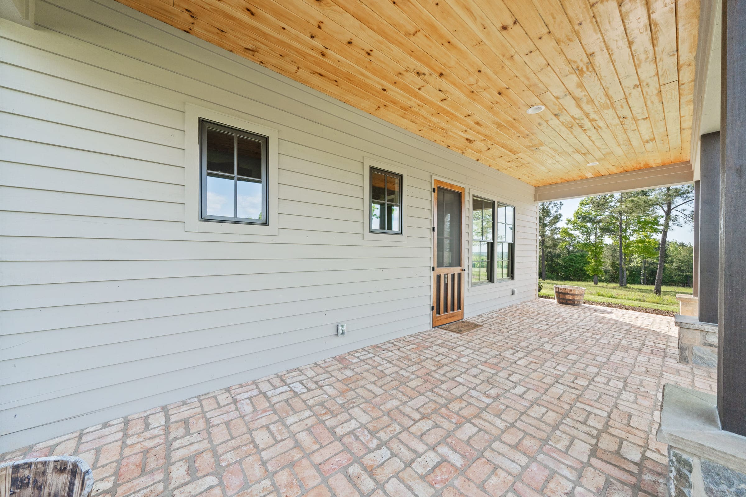Front Brick Patio with Light Wood Ceiling | PAXISgroup