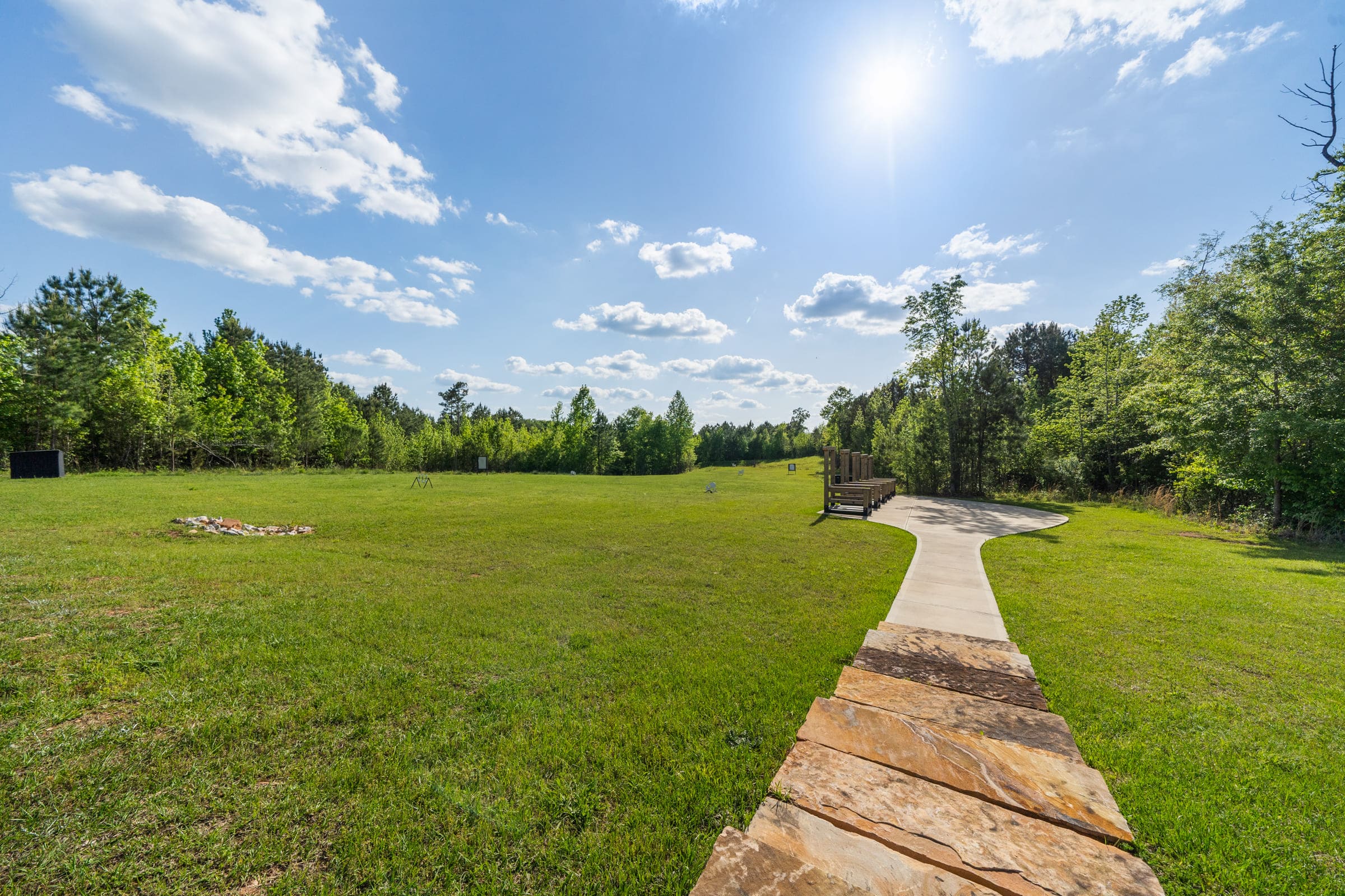 Stunning Backyard View with Stone Steps out to Bench | PAXISgroup