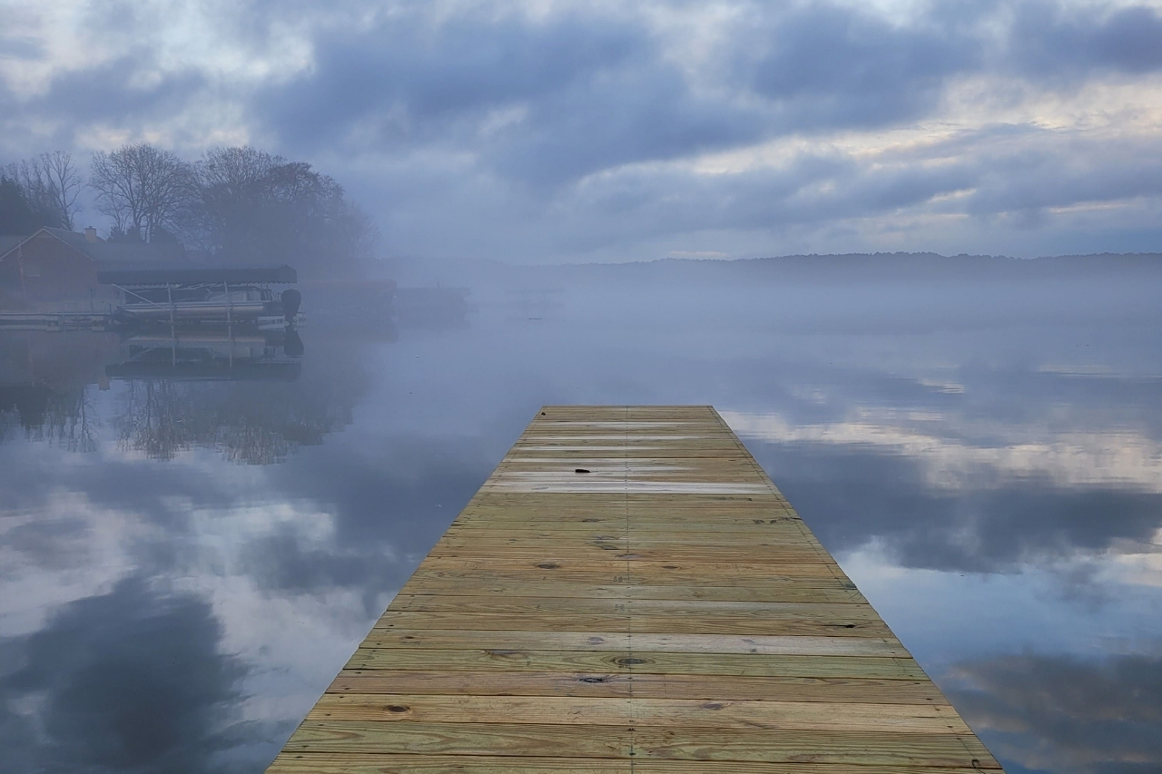 Dock Overlooking Lake Oconee on Fogging Morning at Lakefront Remodeled Home | PAXISgroup Custom Home Builders in GA