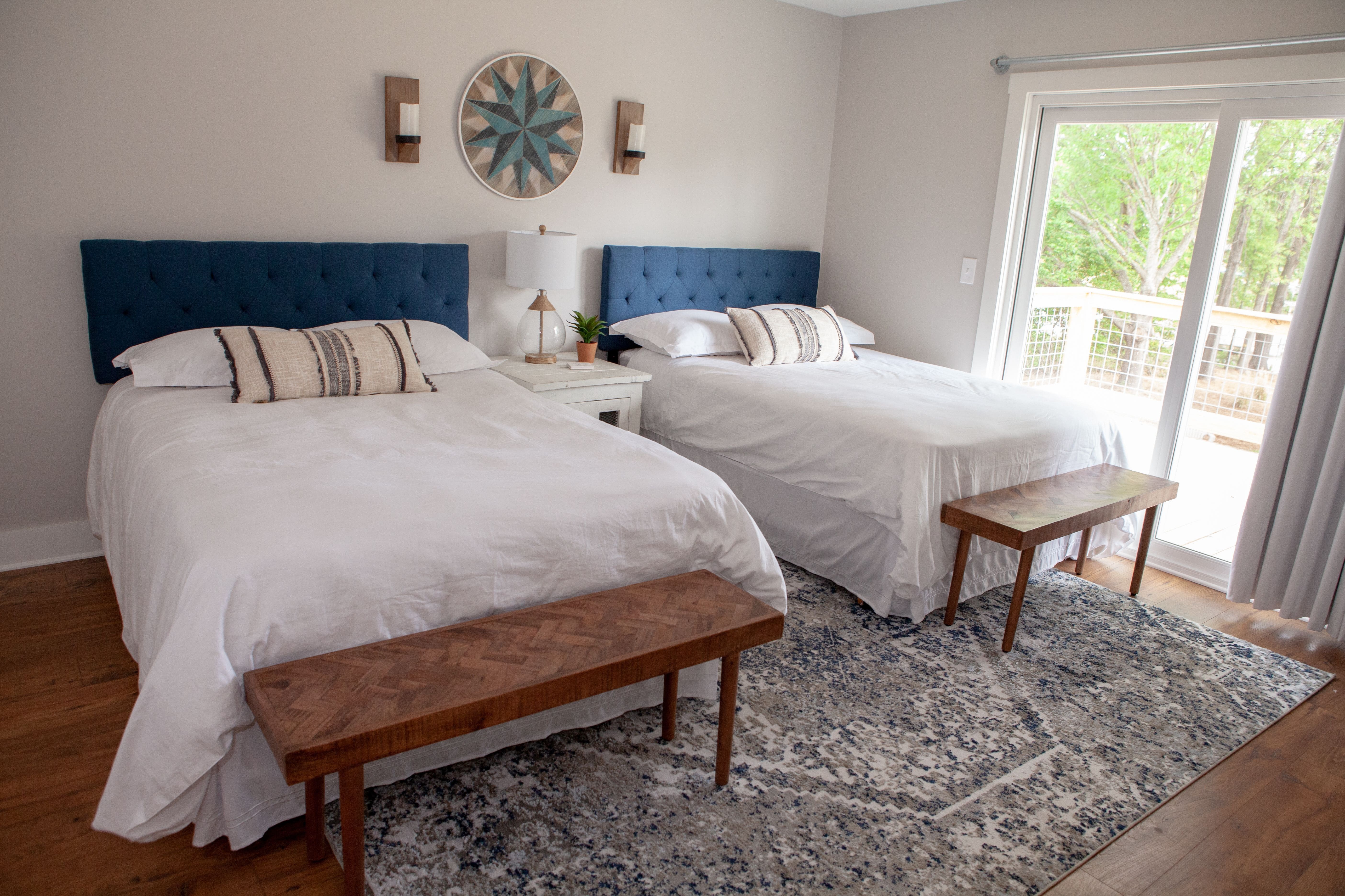 Guest Bedroom with Full Beds in Lakefront Home Remodel | PAXISgroup Custom Home Builders in GA