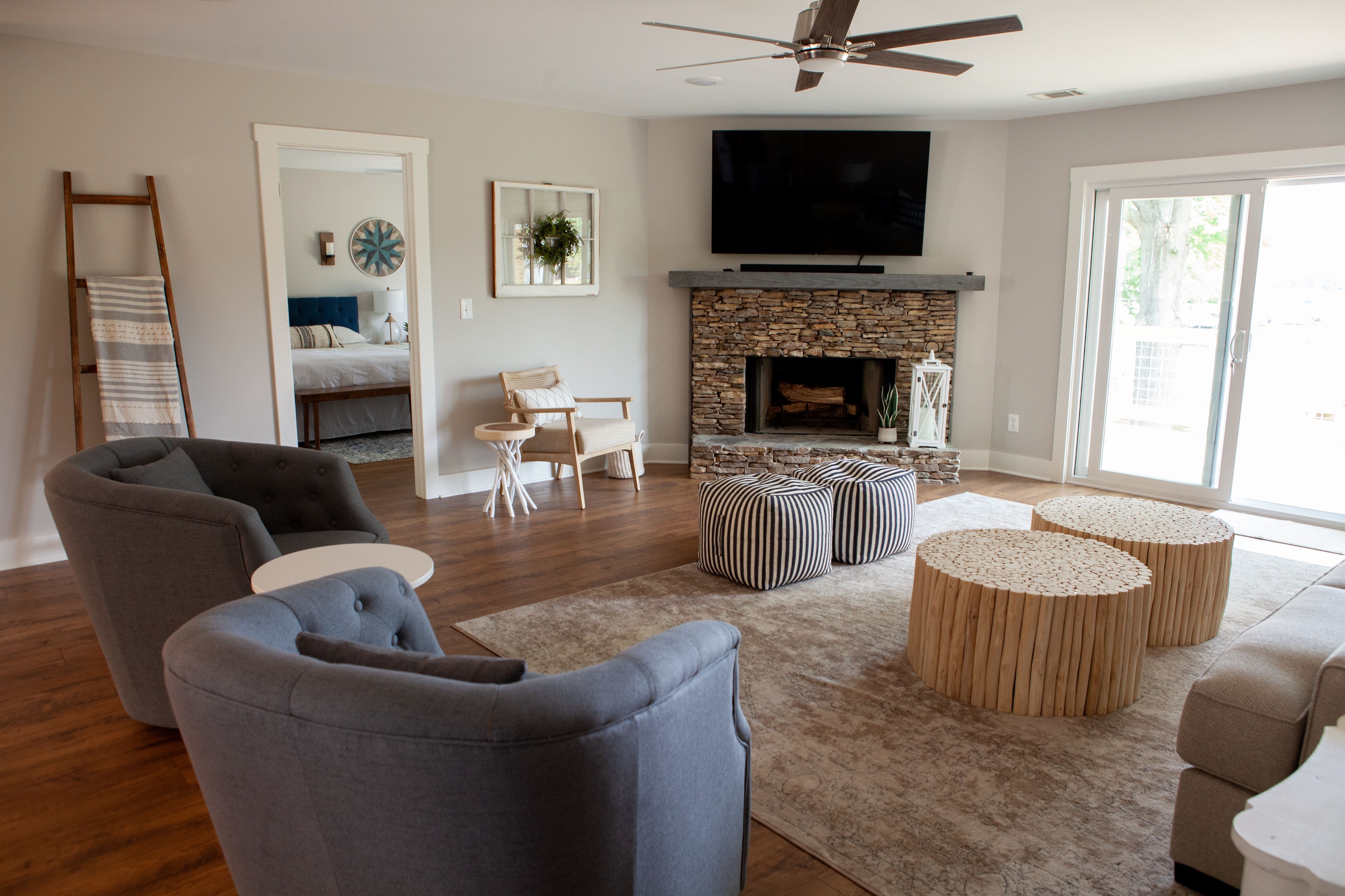 Living Room with Stone Fireplace in Remodeled Home | PAXISgroup Custom Home Builders in GA