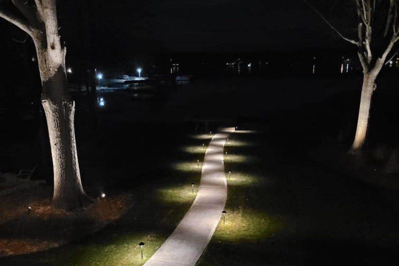 Path to Lakefront Property Lit Up at Night with Lights | PAXISgroup Custom Home Builders in GA