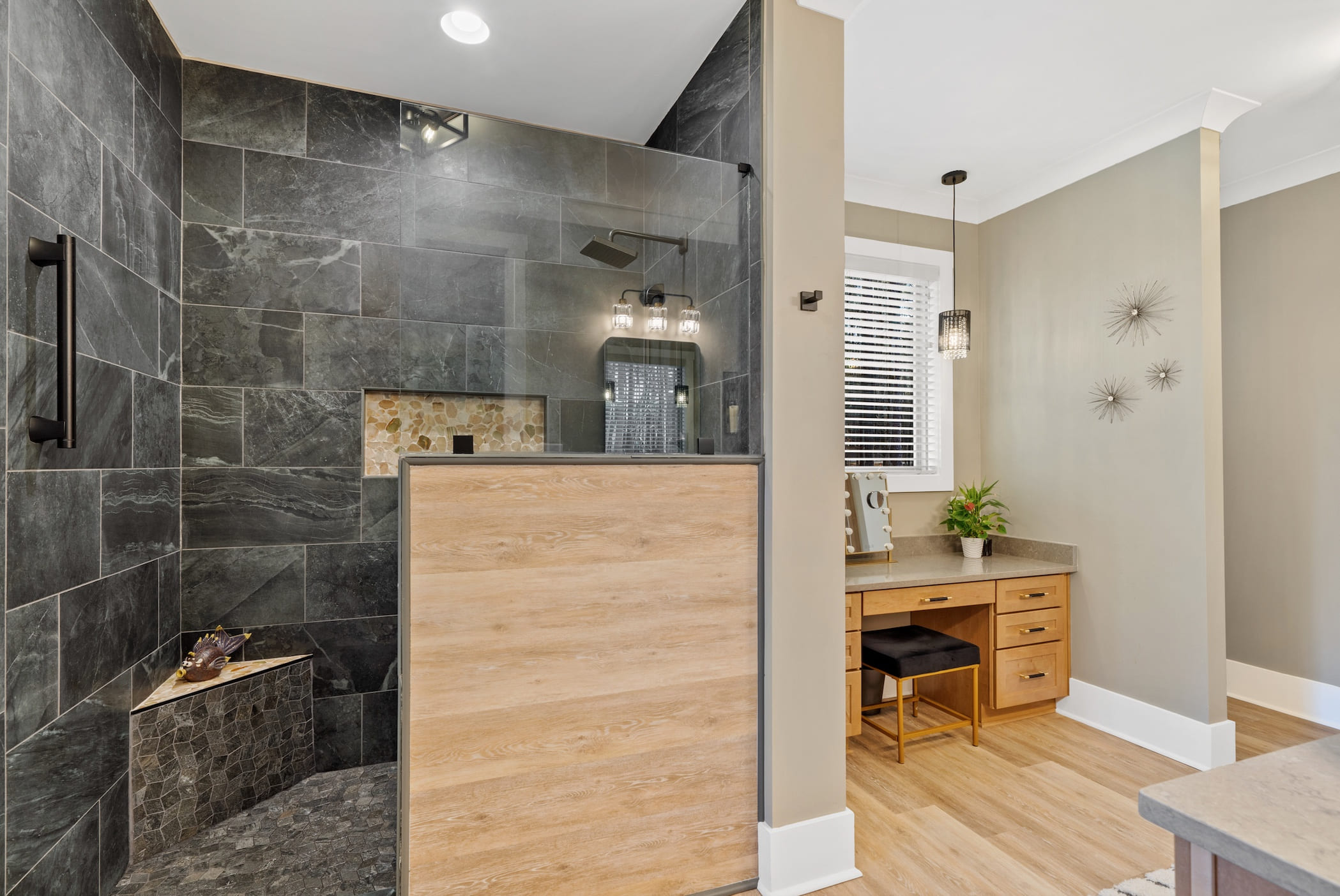 Beautiful Stone Tile Primary Bathroom | PAXISgroup