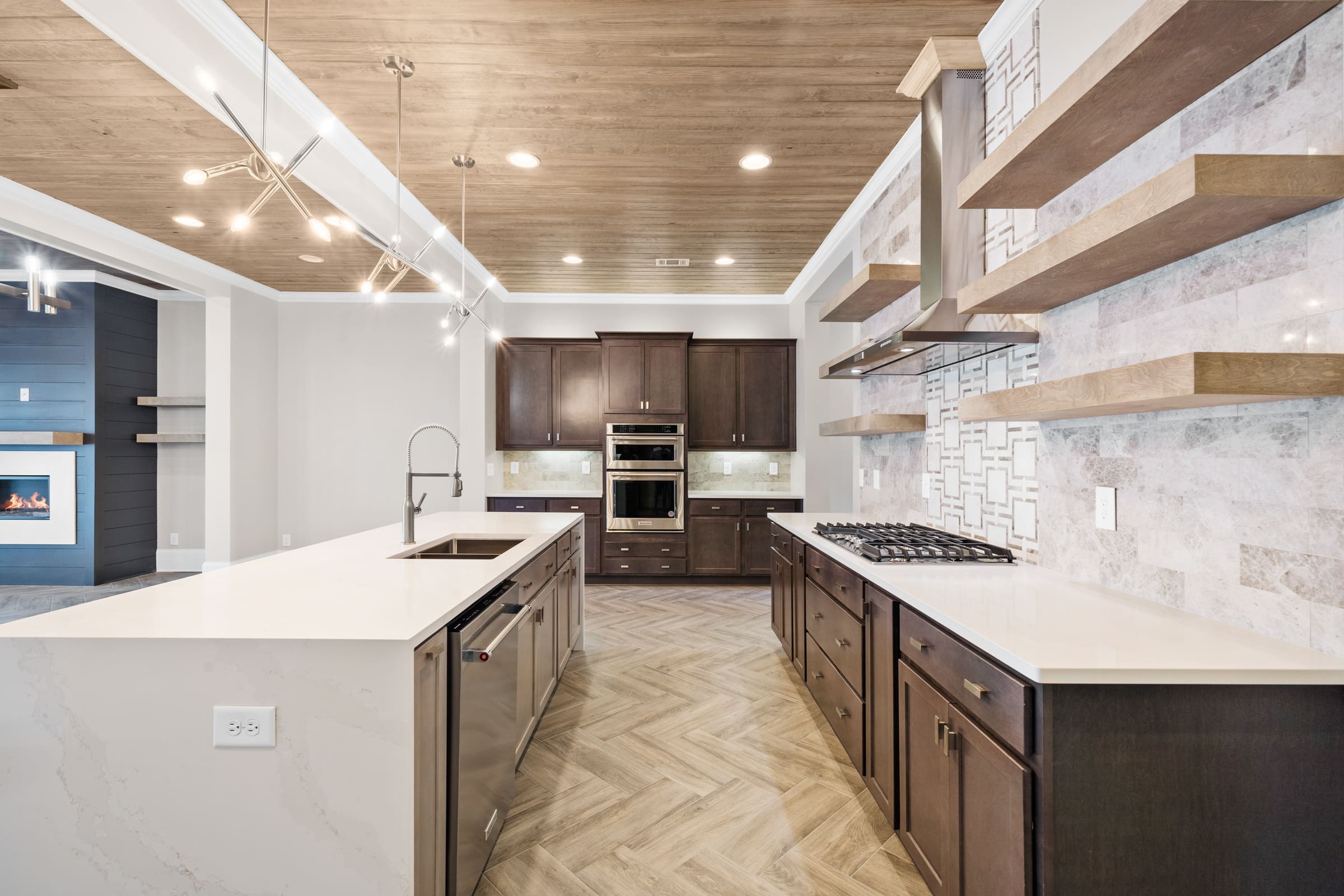 Full Downstairs Kitchen with Dark Hardwood and Granite Features. 