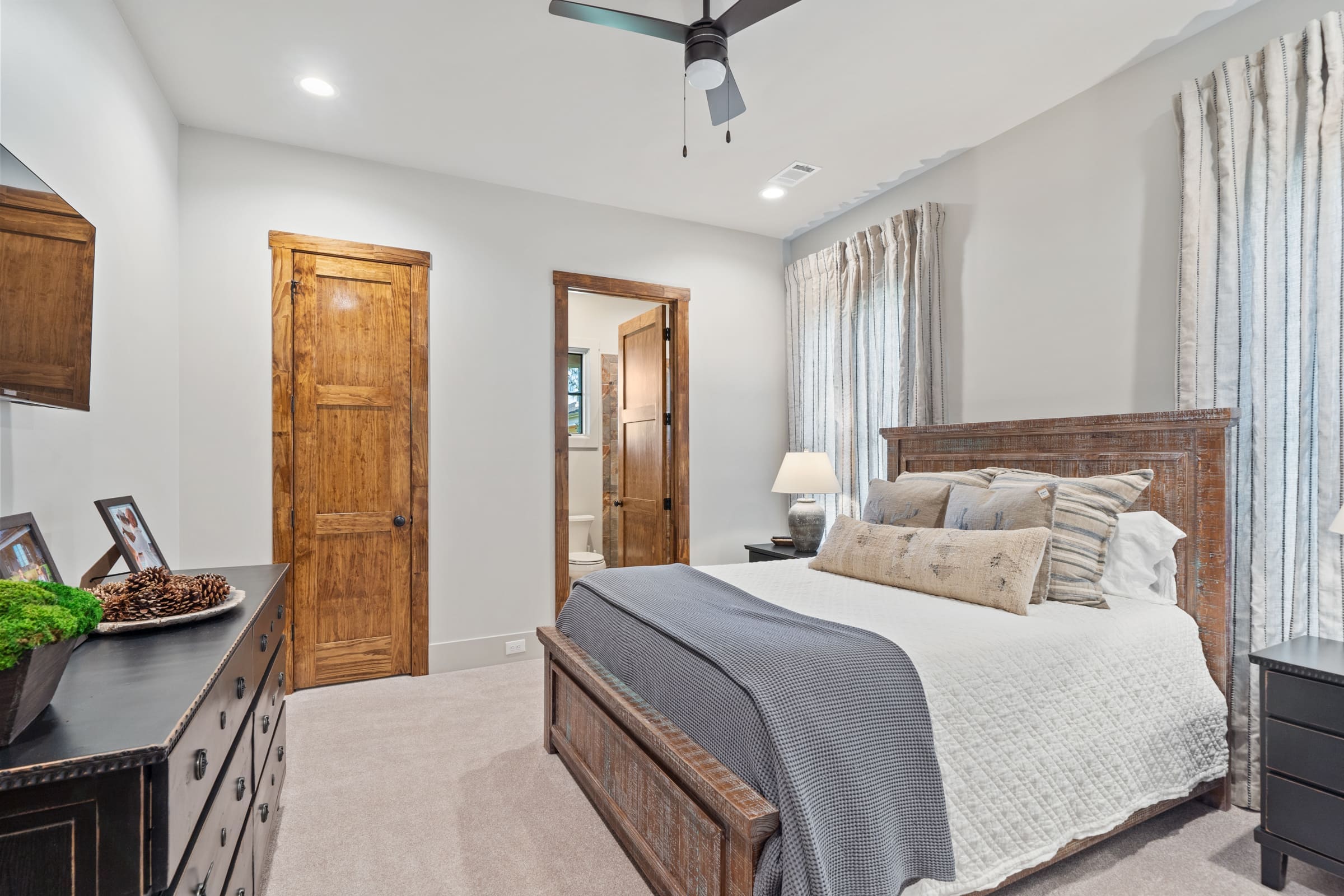 Spacious Bedroom with Beige Carpet and Light Blue Walls | PAXISgroup