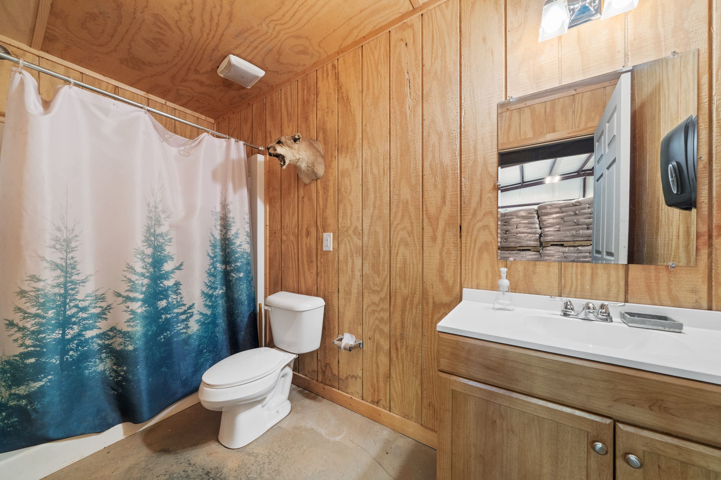 Wood Paneled Bathroom with Single-Sink Vanity | PAXISgroup