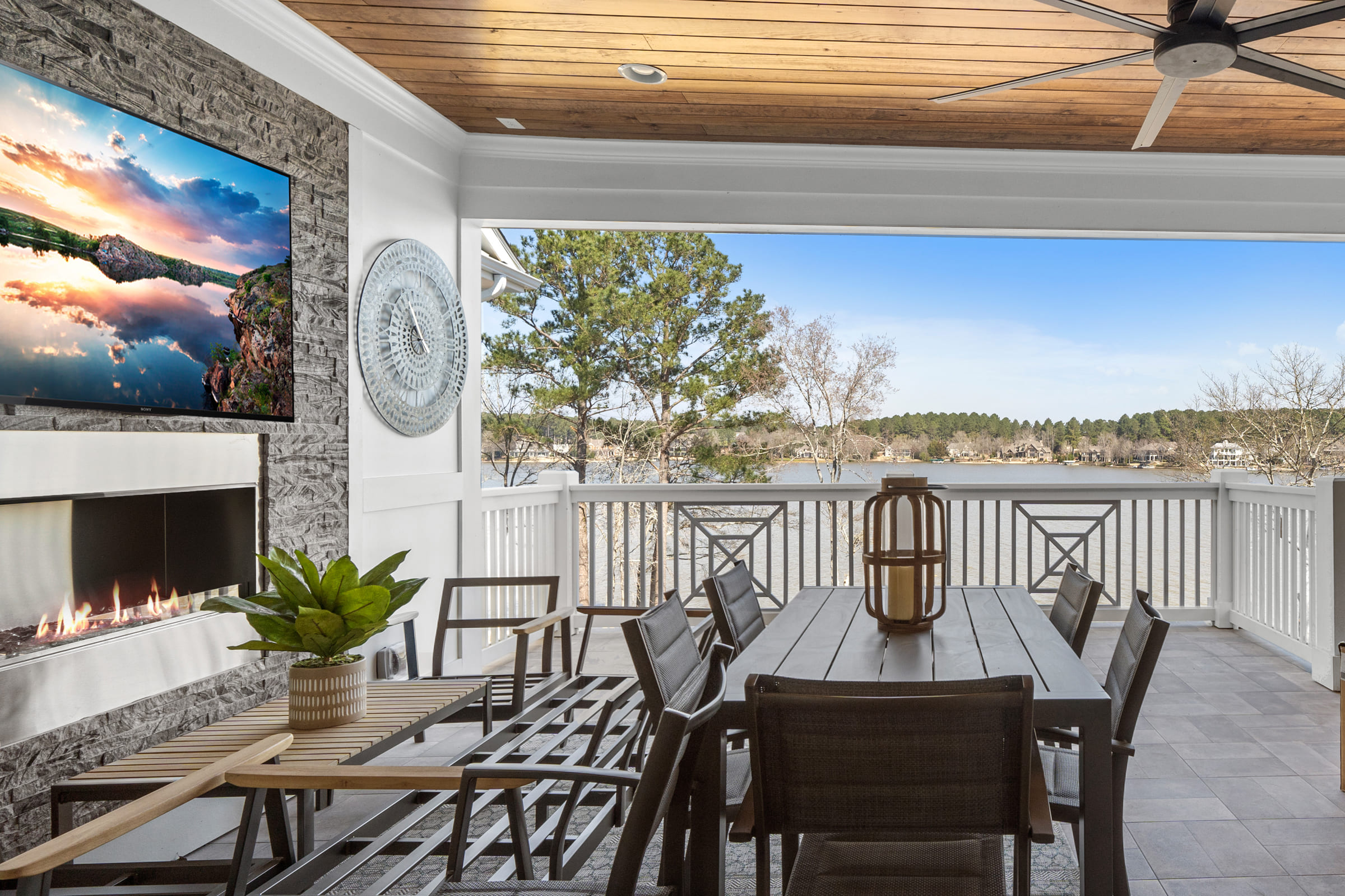 Deck with Built-in Stone Fire Place and TV with Beautiful Lake View |PAXISgroup